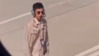 Airport worker's pay reportedly docked after video of him looking hot went viral