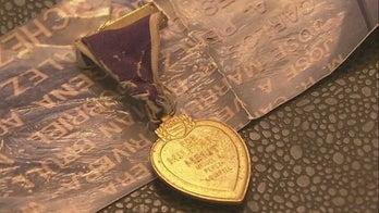 Purple Heart spotted on airport baggage claim belt finds its family