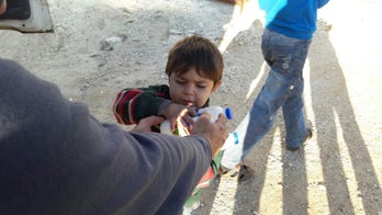 Aleppo's orphans replay their trauma with war games in the rubble