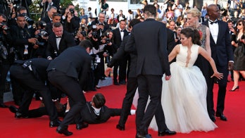 Man attempts to look under America Ferrera's dress on Cannes red carpet