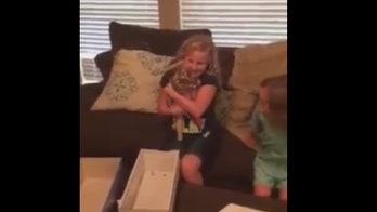 Video of girl receiving doll with matching prosthetic goes viral