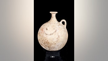 History's 1st emoji? Ancient pitcher shows a smiley face