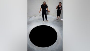 Tourist injured after falling into artist's 8-foot hole at Portugal museum
