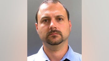 Teacher accused of putting kid in game machine to steal prizes turns self in, placed on leave