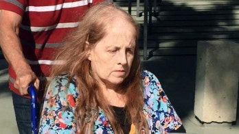 Woman charged in Sandy Hook parent threat a court no-show