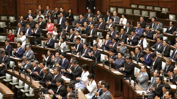 Japan approves contentious bill against planning crimes