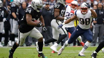 Marshawn Lynch sits for US anthem, stands for Mexican anthem