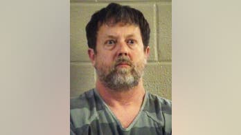 Georgia teacher who fired gun in classroom previously told police he hired hitmen, report says