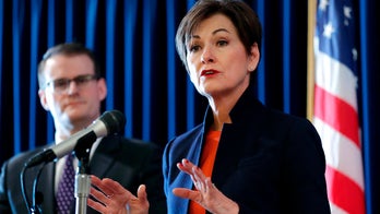 Iowa governor signs fetal 'heartbeat bill' into law