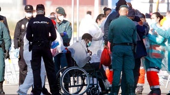 Spain takes in boat packed with hundreds of refugees after Italy turns it away