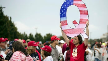 What is QAnon, the conspiracy theory group showing up to Trump rallies?