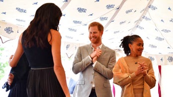 Prince Harry caught sneaking treats for Meghan Markle at charity cookbook event