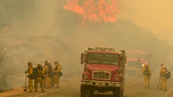 Crews battling 35 large, uncontained wildfires in the West