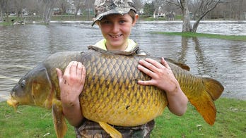 Vermont boy reels in record-breaking carp