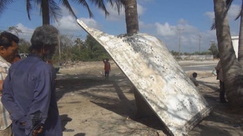Metal that washed up on Thai beach was likely a rocket part, not MH370