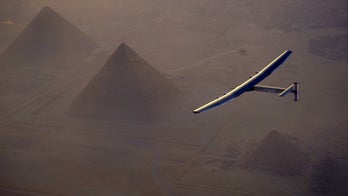 Solar plane flies over Egypt pyramids on globe-circling trip