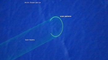 Spooky ring of light created by Arctic's ice-mapping lasers (Photo)