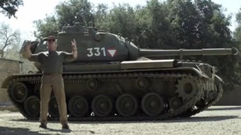 Arnold Schwarzenegger raffling off ride in his tank