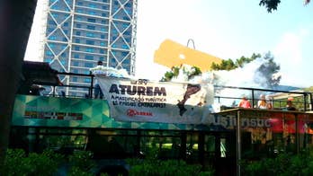 Radical anti-tourism group in Spain storms buses filled with sightseers to protest 'mass tourism'