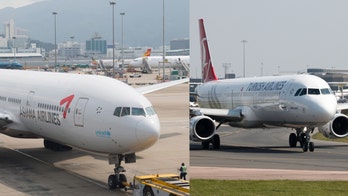 Plane carrying 222 passengers crashes into jet on runway, slices off tail