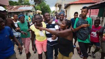 From remote stronghold, Haiti fugitive seeks political power