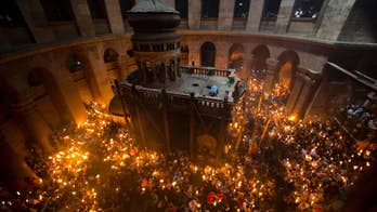 Holy fire ceremony in Jerusalem draws thousands