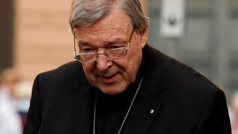 Vatican cardinal hit with sex assault offenses takes leave, will fight charges