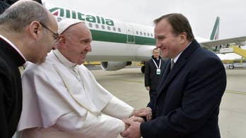 The Latest: Hundreds cheer Pope Francis' arrival in Sweden