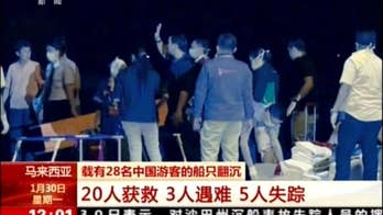 Malaysia searching for 6 missing at sea, detains 2 boat crew