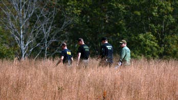 Details about suspect emerge after captive woman's rescue