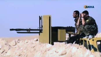 Kurdish-led fighters marching against IS near Syria's Raqqa