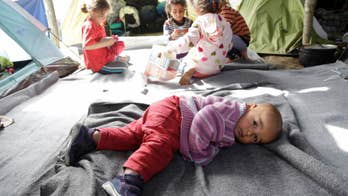 The Latest: German governing parties agree on migrant plan