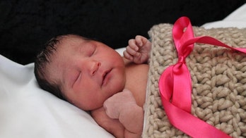 Missing Kansas baby reunited with family, woman in custody