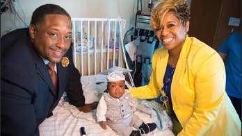 Couple in viral pregnancy announcement take son home year after birth