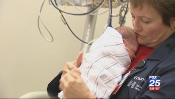 Volunteers at Massachusetts hospital cuddle babies to aid development