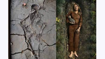 Remains of mysterious Stone Age baby found cradled in mother's arm
