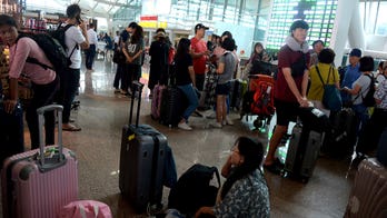 Bali airport reopens, but volcano still spewing ash