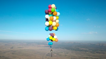 Man flies over South Africa using 100 balloons strapped to camping chair