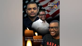 Baltimore police officer dead, cops hunt killer