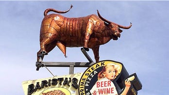 Restaurant sign with well-endowed bull offends locals