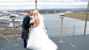Couple weds atop 150 foot crane