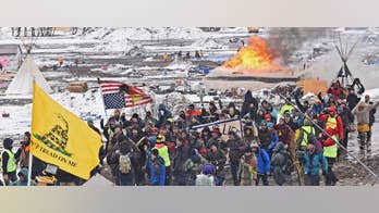 The Latest: Last protesters say they're committed to staying