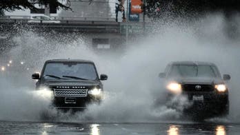 The Latest: Floods sweep through California mountain towns
