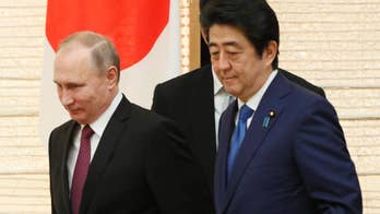 The Latest: Japan relaxes visa requirements for Russians