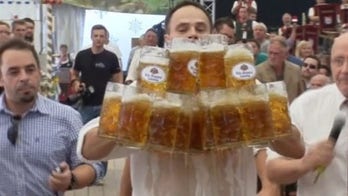 German waiter breaks world beer-carrying record