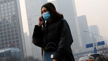 Beijing issues first-ever red alert for smog, forcing schools to close