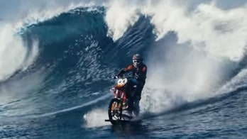 Stunt rider Robbie Maddison takes on a giant Tahitian wave -- on a dirt bike