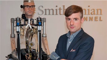 'Bionic man' walks, breathes with artificial parts