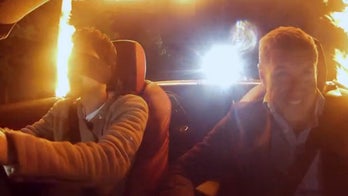 Blindfolded magician takes car for a spin