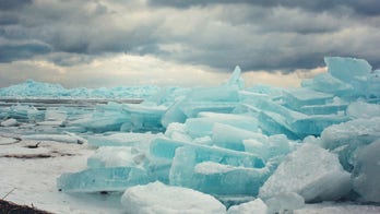 Rare blue ice stacks 'as high as a three-story building' form along Michigan's Great Lakes